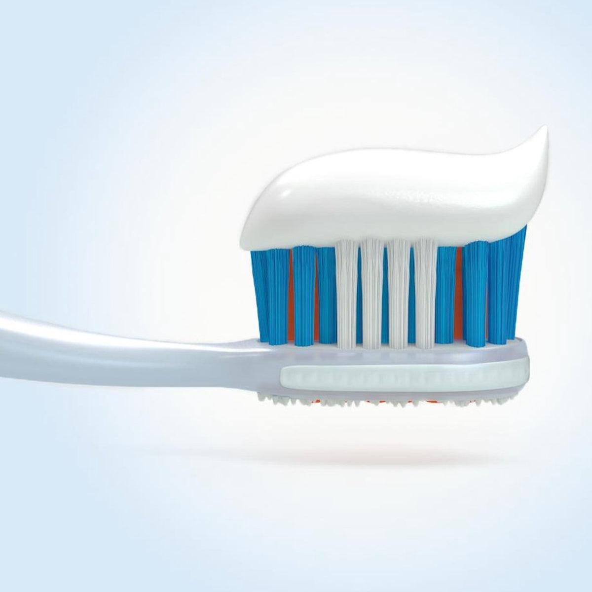 Elmex Anti-Caries Professional tandpasta op tandenborstel met blauwe haren