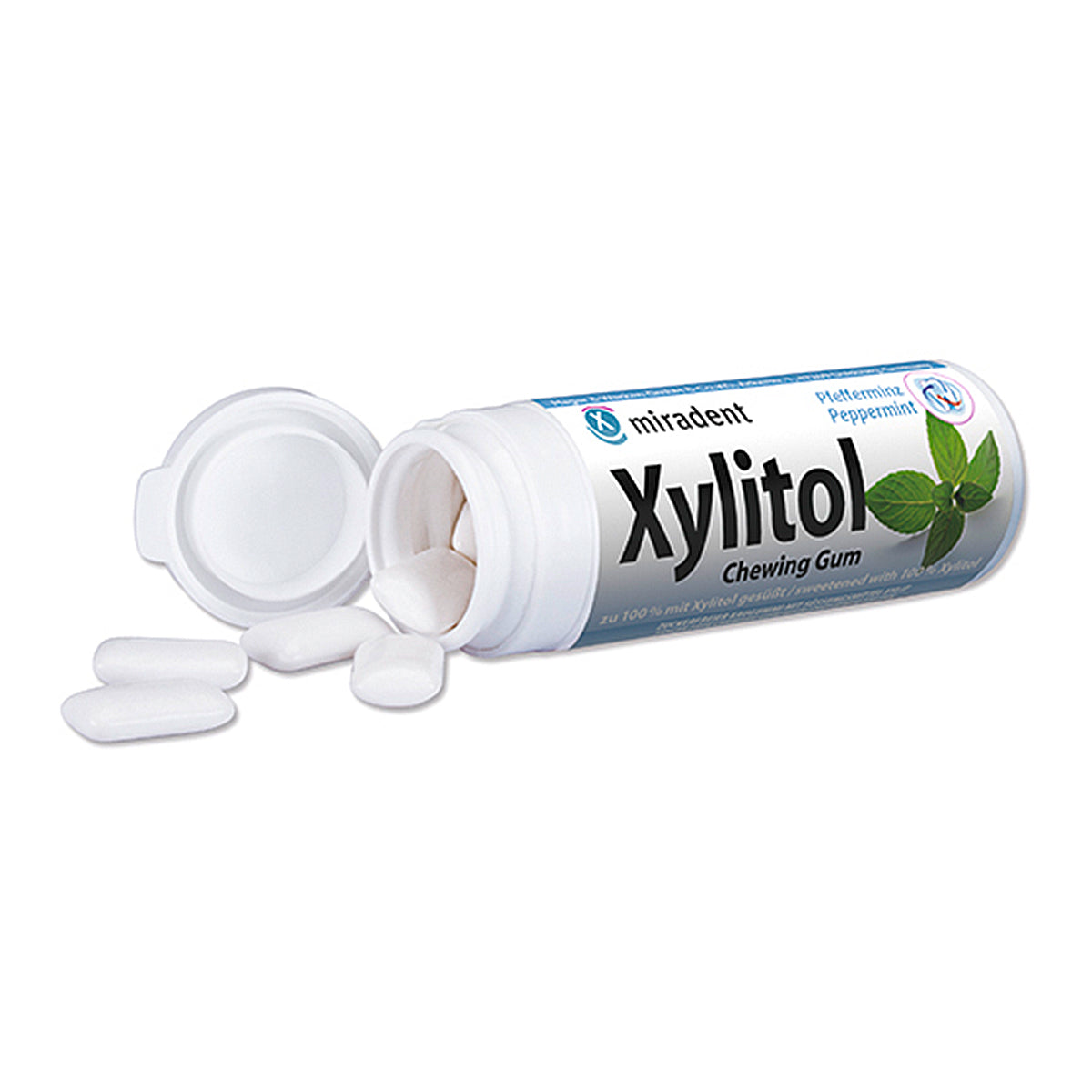 Miradent Xylitol kauwgom pepermunt met open busje en losse kauwgomtabletten ernaast