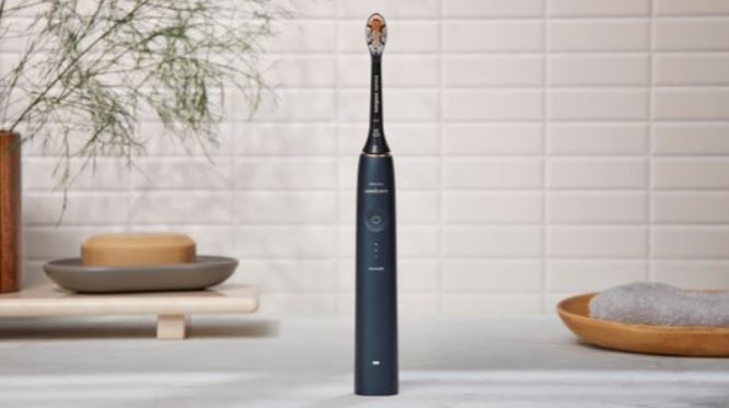 Sonicare A3 Premium AIO zwart rechtop op badkamermeubel met accessoires