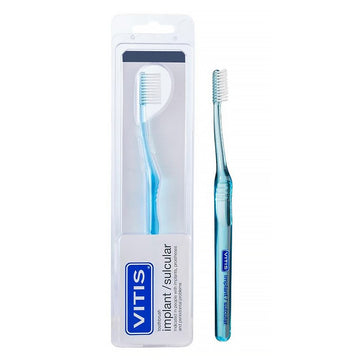Vitis Implant Sulcular tandenborstel in verpakking en los ernaast, blauw handvat