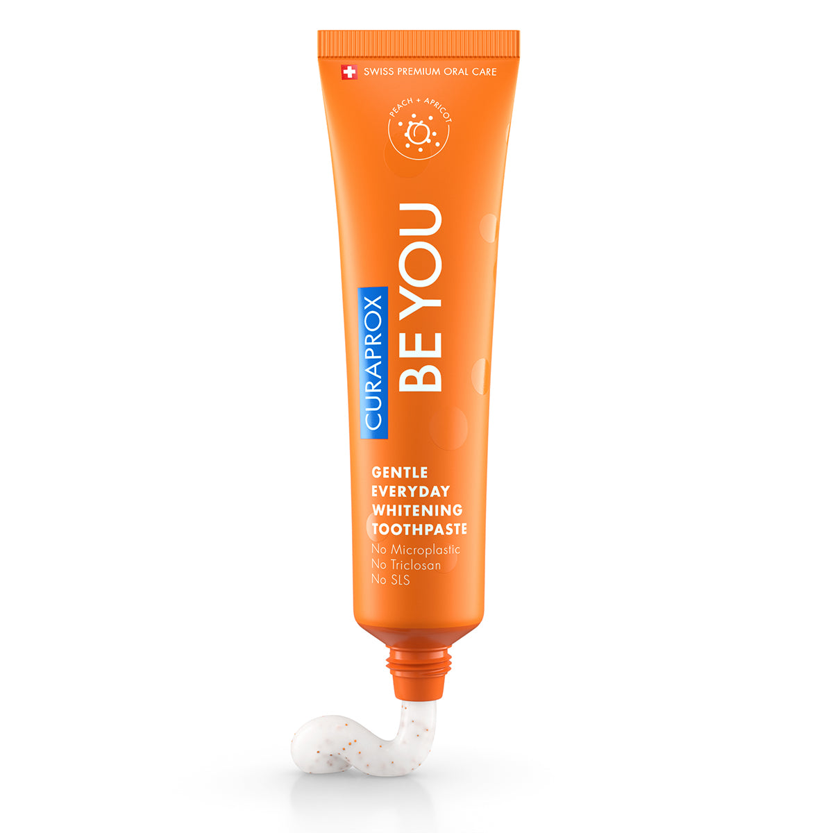 Curaprox BE YOU tandpasta perzik/abrikoos oranje tube met uitgeknepen witte pasta