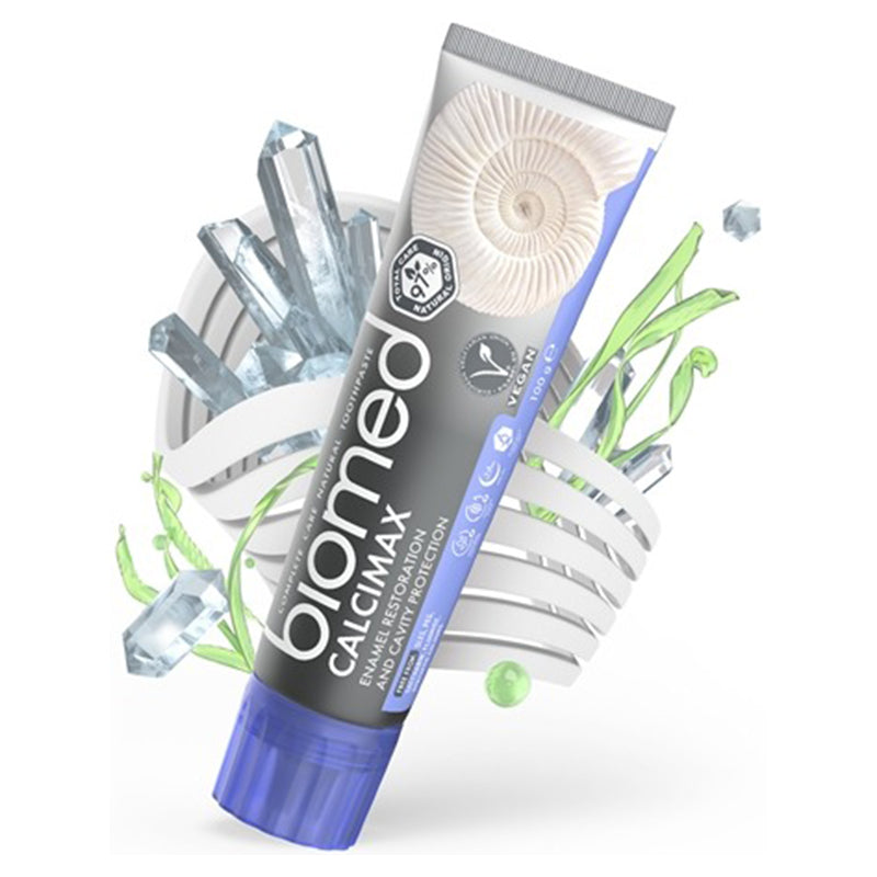 Biomed Calcimax tandpasta tube met kristallen en groene plantillustraties op achtergrond