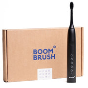 Boombrush Sonische tandenborstel zwart naast bruine kartonnen verpakking